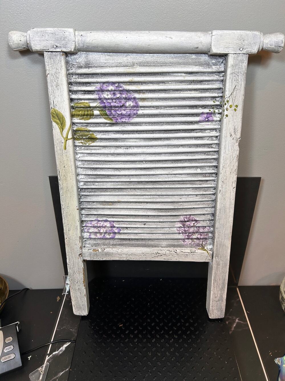 vintage-style, whitepainted wooden washboard with decorative hydrangea transfers